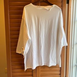 Oversized shirt with button detail at the neck line and arm area.